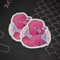 two pink poodle stickers on a black background